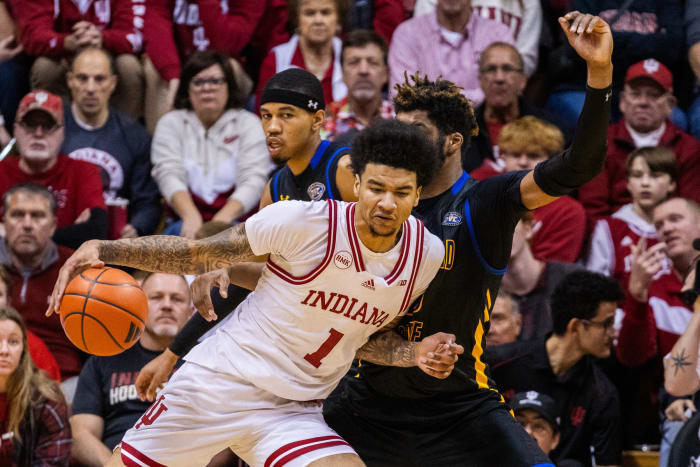 Dec 19, 2023; Bloomington, Indiana, USA; Indiana Hoosiers center Kel'el Ware (1) dribbles the ball while Morehead State Eagles forward Dieonte Miles (23) defends in the second half at Simon Skjodt Assembly Hall. Mandatory Credit: Trevor Ruszkowski-USA TODAY Sports